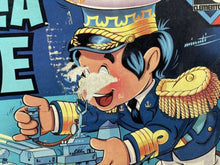 Load image into Gallery viewer, Detail close-up of cartoon character with captain's hat and facial expression.
