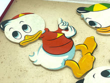 Load image into Gallery viewer, Detail of a red and white Donald Duck puzzle piece.
