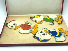 Load image into Gallery viewer, Close-up of colorful game pieces in various shapes.
