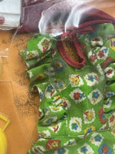Load image into Gallery viewer, Close-up of a red accessory from the Italocremona set with textured fabric.
