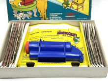 Load image into Gallery viewer, Close-up of a blue toy showing colorful packaging and plastic material.
