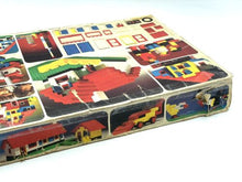 Load image into Gallery viewer, LEGO 1973 Vintage Basic set side view of box featuring colorful illustrations and slight damage.
