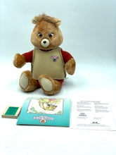 Load image into Gallery viewer, Lifestyle shot of Teddy Ruxpin bear with soft material and button eyes.
