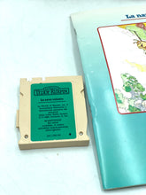 Load image into Gallery viewer, Detail shot of storybook and card with illustrated cover and text.
