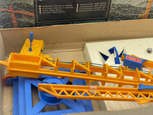 Load image into Gallery viewer, Co.Ma VINTAGE 70's COMA CRANE RC GRU HERCULES toy components inside the box, showcasing plastic parts.
