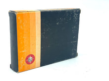 Load image into Gallery viewer, Side view of the VINTAGE Reel TV GAME Motocross Cartridge box with a smooth black and orange surface.
