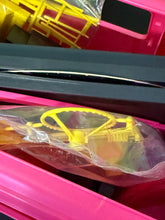 Carica l'immagine nel visualizzatore di Gallery, Barbie Hot Rockin’ Van Rock Mobile detail shot of yellow plastic item in packaging.
