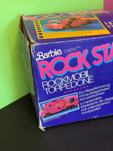 Carica l'immagine nel visualizzatore di Gallery, Side view of Barbie Hot Rockin’ Van box featuring the Barbie logo.
