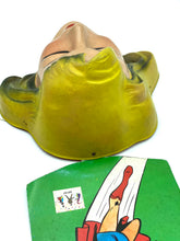 Load image into Gallery viewer, Back view of a green head figurine with a tag attached
