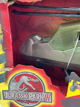 Load image into Gallery viewer, Close-up detail of the Hasbro Jurassic Park helicopter's rotor blades and cockpit.
