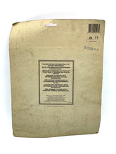Load image into Gallery viewer, Back view of the packaging with text on a plain brown surface.
