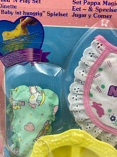 Load image into Gallery viewer, Detail shot of a toy accessory with playful patterns in blue and pink.
