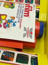 Load image into Gallery viewer, Close-up of colorful film packaging with graphics and text labels.
