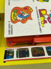 Load image into Gallery viewer, Detail shot of red plastic pieces and colorful cards from the KENNER game.
