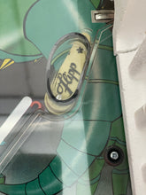 Load image into Gallery viewer, 1978 stardrake pinball detail close-up of another mechanical part with a label in green and yellow.
