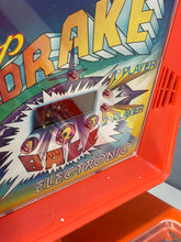 Load image into Gallery viewer, 1978 stardrake pinball detail close-up of space-themed artwork featuring character illustrations in blue and red.
