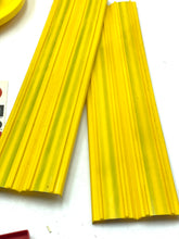 Carica l'immagine nel visualizzatore di Gallery, Hot Wheels Speed Shifter 500 yellow plastic strips with a textured surface on a white background.
