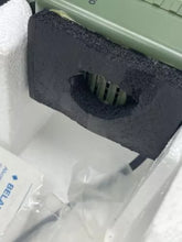 Load image into Gallery viewer, Fisher Price Sonic Rangers Radio Headset close-up of green device showing open slot and cable.
