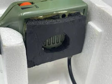 Load image into Gallery viewer, Fisher Price Sonic Rangers Radio Headset close-up of green device with open slot and cable.
