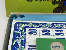 Load image into Gallery viewer, Detail close-up of Loopy de Loop board game components showing game board and tokens.
