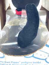 Load image into Gallery viewer, Detail view of the black plush German Shepherd toy with a soft texture.
