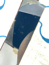 Load image into Gallery viewer, Close-up of a smooth navy and silver metal object with a curved design.

