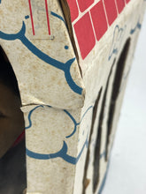 Load image into Gallery viewer, Close-up of packaging corner with cardboard texture and blue pattern.
