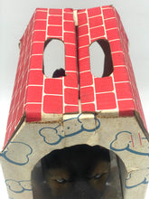 Load image into Gallery viewer, Front view of the red patterned box with roof design and cut-out windows.
