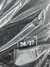 Load image into Gallery viewer, Detail shot of the packaging with number 34/97 and two gray plush toys.
