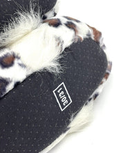 Load image into Gallery viewer, Close-up of a plush owl toy with soft fur and a tag label.

