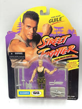 Load image into Gallery viewer, Close-up detail of the action figure packaging highlighting accessories and brand logo.

