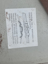 Carica l'immagine nel visualizzatore di Gallery, Close-up of a paper document with printed text and torn edge

