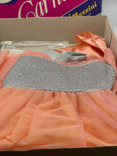 Carica l'immagine nel visualizzatore di Gallery, Lifestyle shot of Barbie dress with accessories inside the box.
