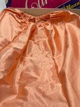 Carica l'immagine nel visualizzatore di Gallery, Ferrari Mazzini front view of the orange dress with smooth fabric and gathered design.
