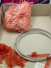 Carica l'immagine nel visualizzatore di Gallery, Ferrari Mazzini packaging view showing pink fabric and loose fabric pieces.
