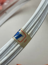 Carica l'immagine nel visualizzatore di Gallery, Ferrari Mazzini detail view of a white hoop with label detail.
