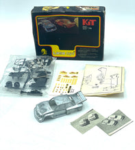 Load image into Gallery viewer, Lifestyle shot of Luso Toys K-14 model car kit contents including parts and instruction manual.
