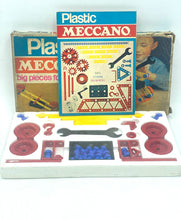 Load image into Gallery viewer, Front view of the Meccano set box showcasing colorful art, game pieces, and instruction manual.
