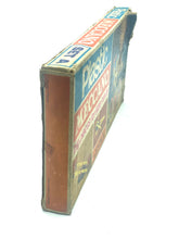 Load image into Gallery viewer, Side view of the Meccano box featuring a colorful design with blue, orange, and brown.
