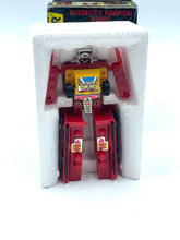 Load image into Gallery viewer, Front view of Transformers G1 Inferno in box, showcasing red and yellow toy with visible packaging.
