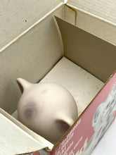 Load image into Gallery viewer, Inside view of the box showing a piggy bank with ear design.

