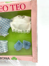 Load image into Gallery viewer, Close-up of a white outfit with blue accessories from the Italocremona vintage dress set.
