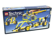 Load image into Gallery viewer, Close-up of LEGO Technic contents including instruction manual and model parts.
