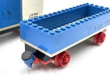 Carica l'immagine nel visualizzatore di Gallery, Close-up detail of a blue toy train car with an open top and wheeled base.
