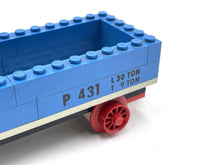 Carica l'immagine nel visualizzatore di Gallery, Close-up detail of a blue toy train car featuring an open top and wheeled base.

