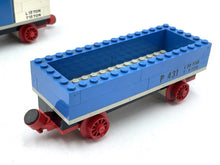 Carica l'immagine nel visualizzatore di Gallery, Close-up detail of a blue toy train car with an open top and wheeled base.
