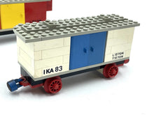 Carica l'immagine nel visualizzatore di Gallery, Side view of a toy train car in blue and white with a blue door and red wheels.
