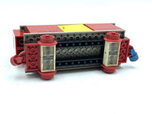 Carica l'immagine nel visualizzatore di Gallery, Side view of a toy train car in red and yellow with a detailed design.
