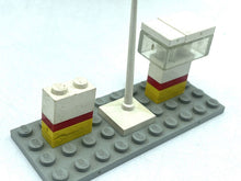 Carica l'immagine nel visualizzatore di Gallery, Close-up of LEGO flag and stands with white, gray, and yellow colors.

