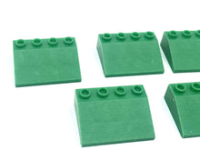 Load image into Gallery viewer, LEGO green building blocks close-up detail featuring flat pieces and interlocking design.
